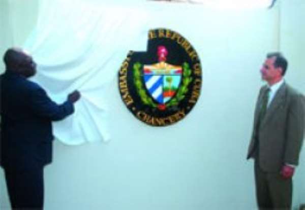 Alhaji Muhammed Mummuni (left), Ghana's Foreign Minister unveiling the logo of the Cuban Embassy. Looking on is Dr Miguel Perez Cruz, Cuban Ambassador.