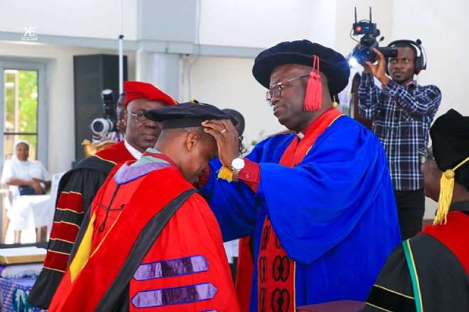 221202590456-uapctgfsrm-moderator-of-pcg-rt-rev-dr-abraham-nana-opare-kwakye-decorating-rev-dr-chris-baah-nartey-during-his-phd-graduation--1.jpeg
