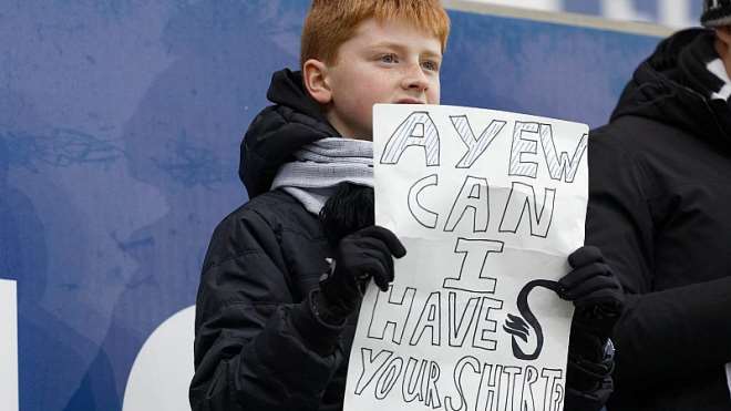 224202093756-j4eq276ggb-fans-swansea-city-v-huddersfield--18