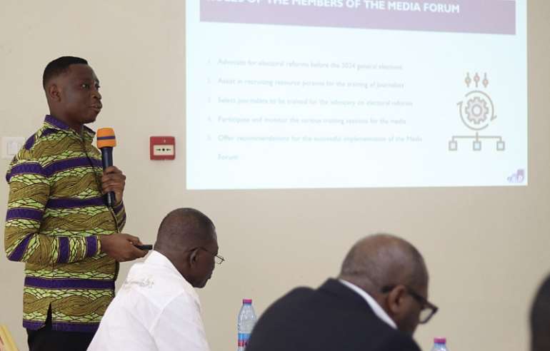 Joseph Oti Frimpong, Programs Officer at CDD-Ghana, delivering a presentation at the meeting