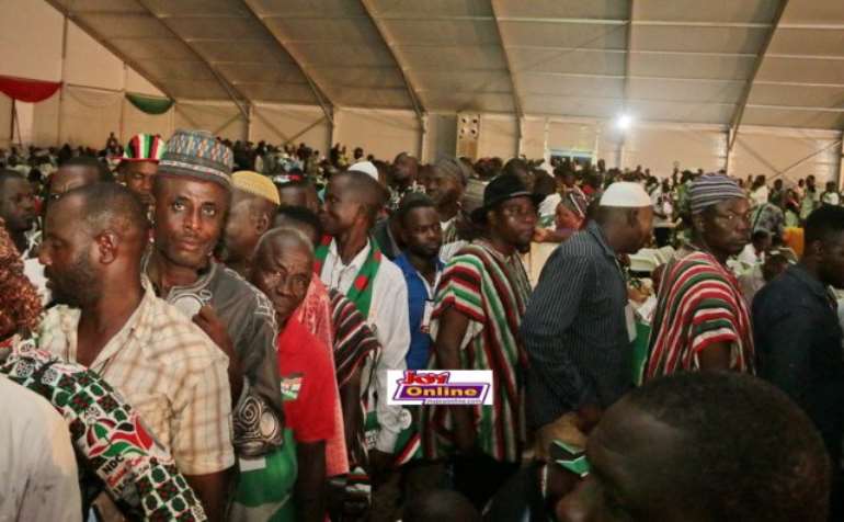 Image: delegates join long queues to vote.