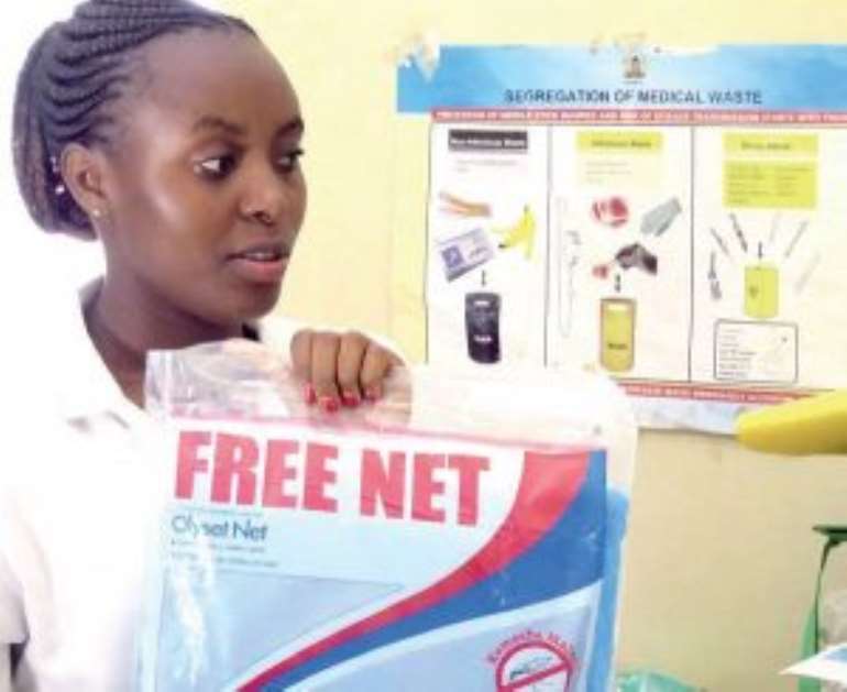 A nurse with a sample of the free mosquito nets