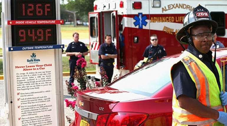 EMS officials participate in a demonstration of the dangers of leaving children unattended in vehicles during a news conference to launch the Look before You Lock campaign at the Campagna Center at George Washington Head Start on August 17, 2012 in Alexandria, Virginia. Chip Somodevilla/Getty Images