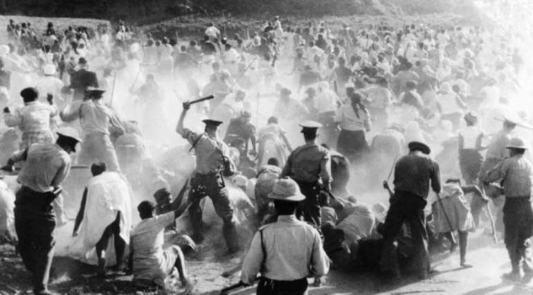 Dutch Apartheid police beating up demonstrators.