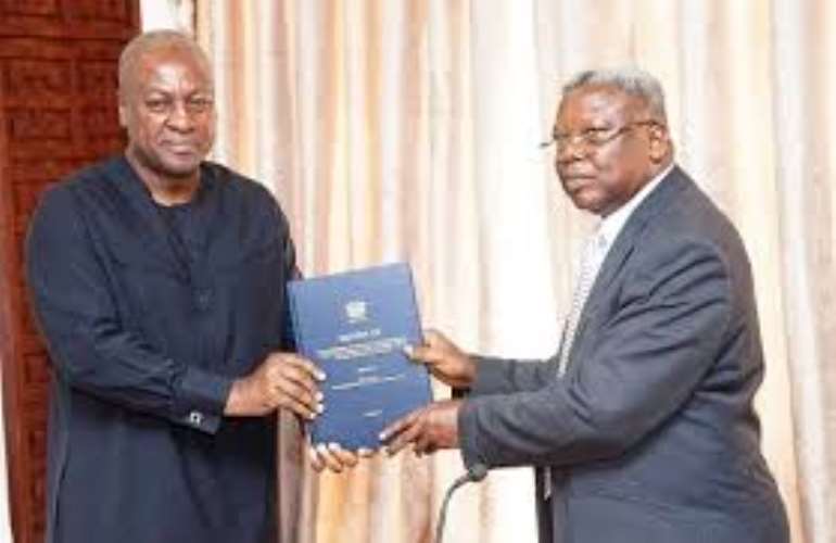 Photo: President John Mahama receiving the report of the Sole Commissioner Justice Yaw Apau