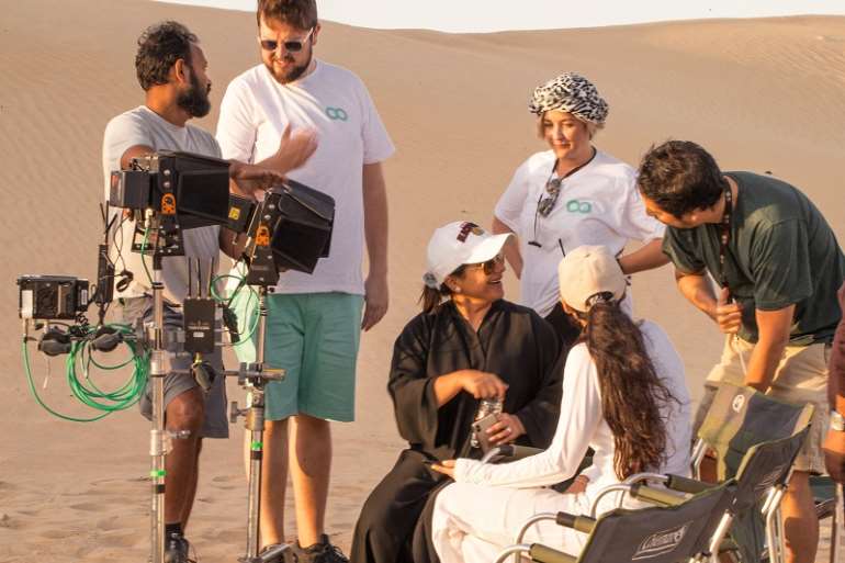 910201990315-uaqctgfsrm-nayla-on-set-directing-expo2020e28099s-world-orchestra-for-uaee28099s-national-day-anthem