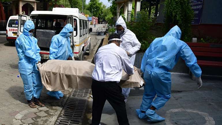  Caption: Bodies continue to arrive in mortuary in Delhi from Covid - Credit: Jitender Gupta
