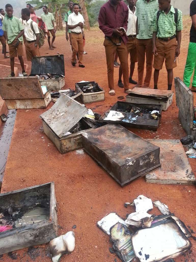 Burnt trunks of the students recovered after the fire was dowsed