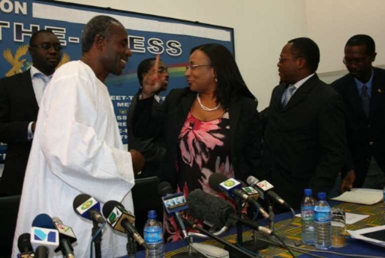 Mr Colins Dauda, (right) Minister of Lands and Natural Resources looking at exhibited items display. With him is Mrs Zita Okakoi, (left) Minister of Information and some another Chief executives from the Ministry.