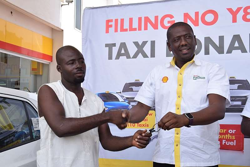 Mr. Kwame Ackah (right), Retail Manager Of Vivo Energy Ghana Presenting The Car Key To The Ultimate Winner Of The First Mini Draw, Samuel Agbesi (