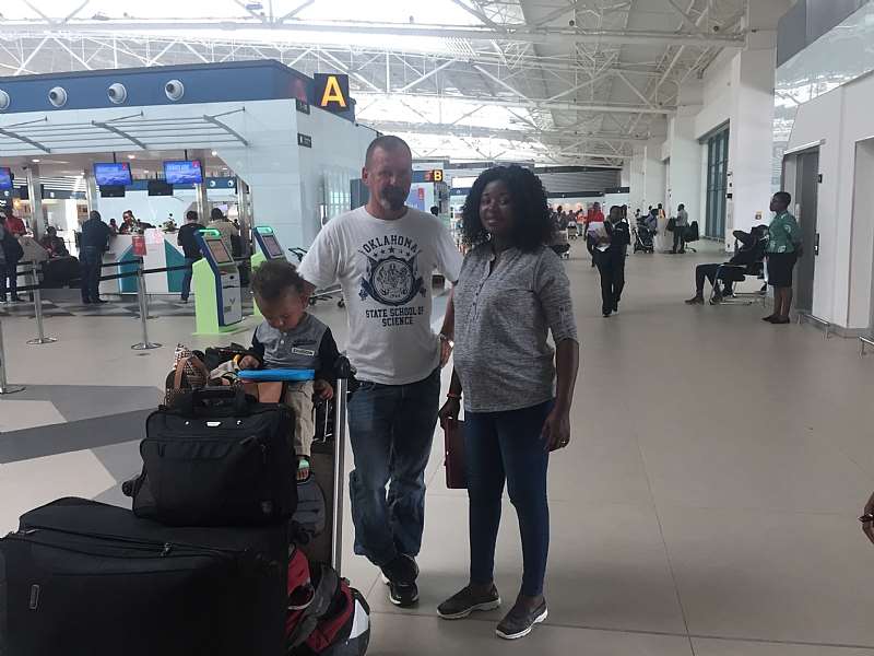 103201874212 ptkwn0y442 madam patience bempong with her husband and son ready to board the fligh.