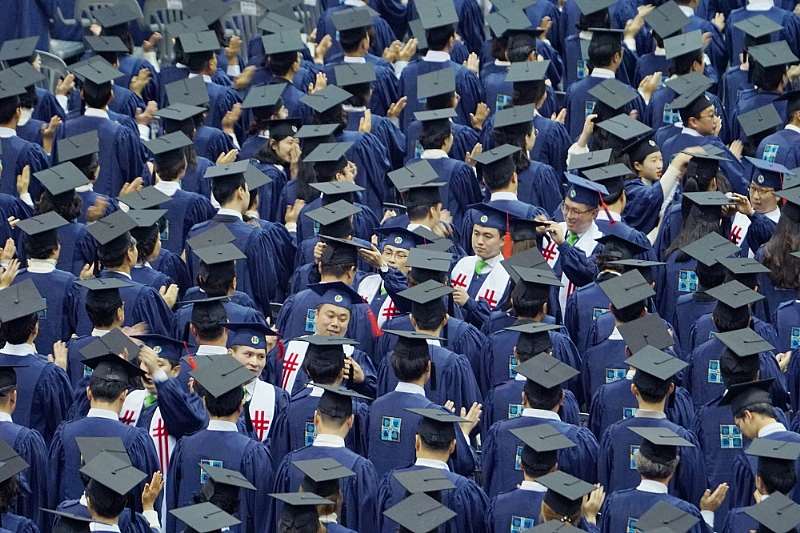 Shincheonji Instructors Are Crossing The Graduation Cap Tassels Of Graduates