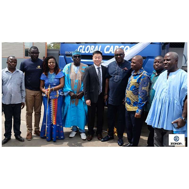 Customers pose with an executive of Zonda Tec Ghana Limited