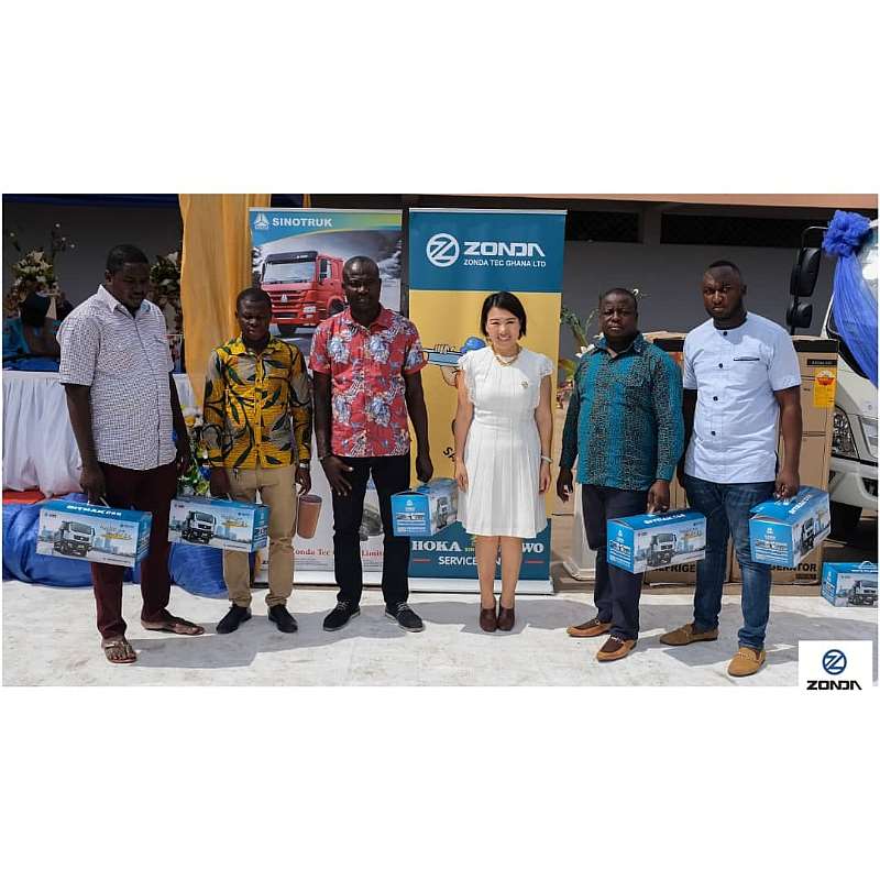Some loyal customers in a pose with Zonda Ghana CEO, Yang Yang (middle)