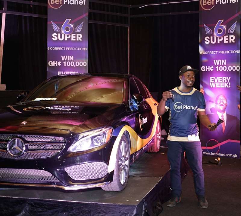 Samuel Tawiah Posing Next To His Mercedes While Flaunting His Car Key