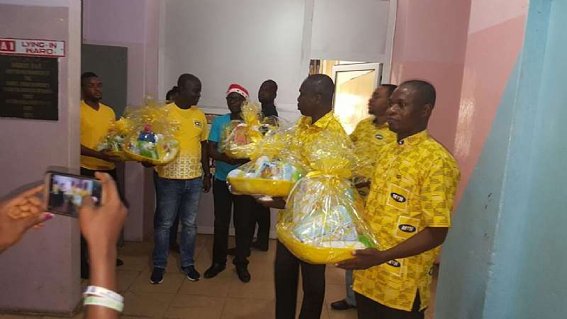 Staff Volunteers Carring Hampers To Be Presented To Mothers And Their Ba...