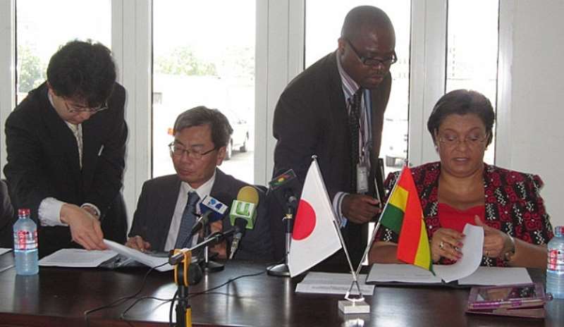 Japanese Ambassador Naoto Nikai and Ghanas Minister for Foreign Affairs, Hon. Hanna Tetteh signing the grant agreement