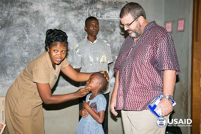 USAID School Health Examination: USAID/Ghana Mission Director Andy Karas observes a school health examination conducted by students from the USAID-supported Community Health Nurses Training College.Photo Credit: Yooku Ata-Bedu, USAID/Ghana