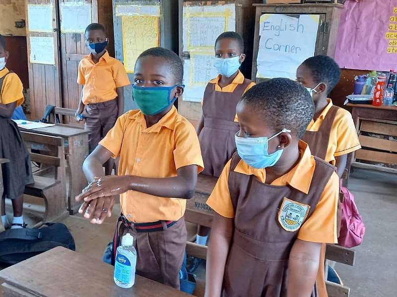 222021125509-l5gsj7u3i1-pupil-applying-hand-sanitizer