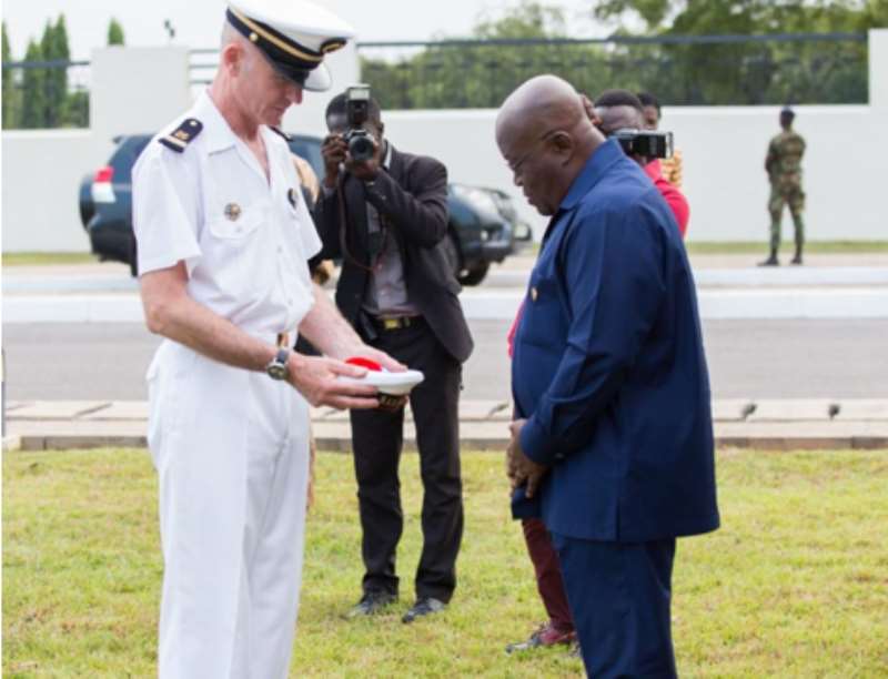 Major Renard, leader of the group, offered a traditional cap from the navy band to the president