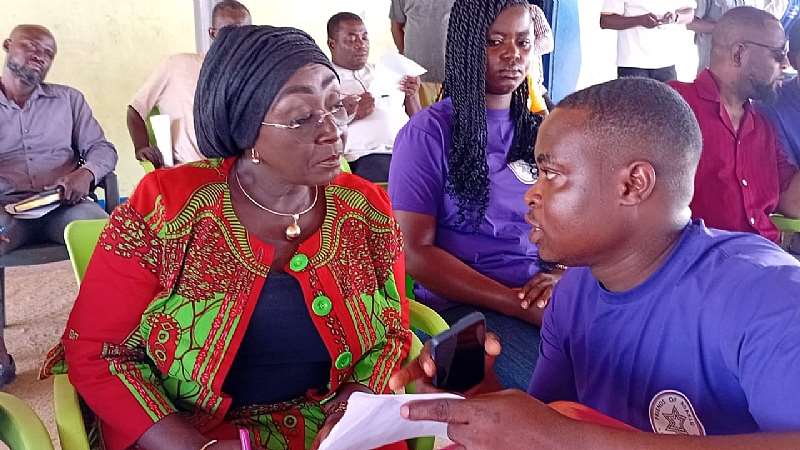 Hon. Abla Dzifa Gomashie MP for Ketu South and Minister for Tourism,Culture and Creative Arts speaking with avolunteer with Friends of Adaklu during the launch of The SeaWorks At Night project at Agavedzi.