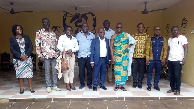 Nana Nteboah Pray IV in a group photograph with the New Sankofa Gold Board and the MCE for Prestea