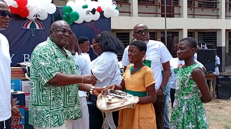 Hon. Mawutor Agbavitor donating some items to learners of Philip Akpo JHS as part of his birthday celebration.