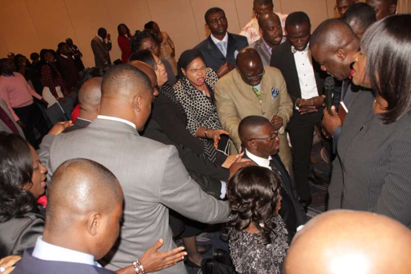 A HOST OF PASTORS PRAYING FOR THE COUPLE