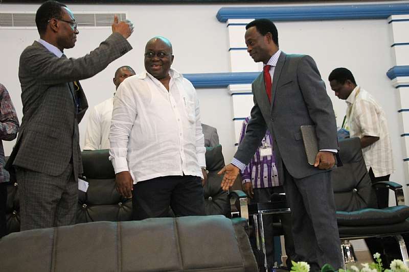 APOSTLE DR. OPOKU ONYINAH (R) AND THE GENERAL SECRETARY, APOSTLE KUMI-LARBI (L) INTERACTING WITH NANA ADDO