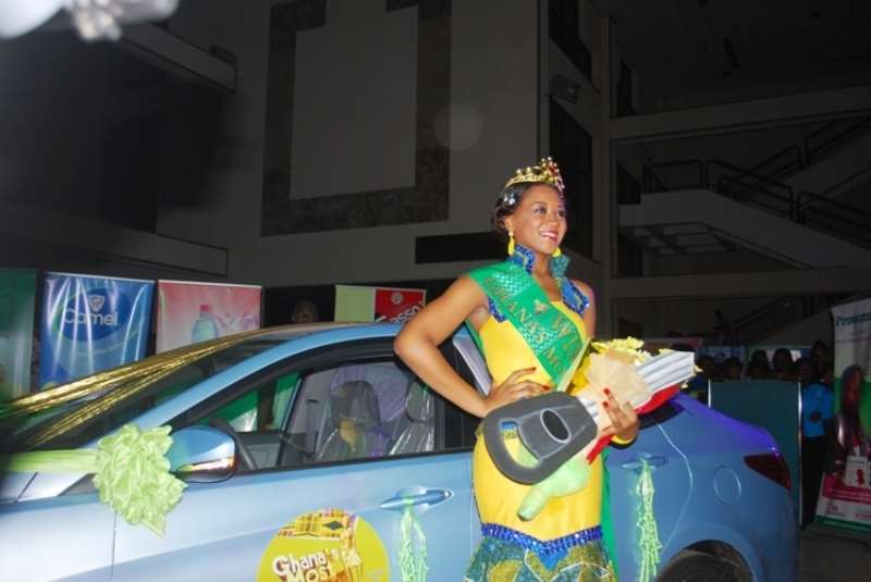 BACI BY HER PRIZE CAR.