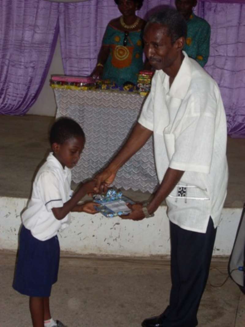 Charles Aboagye (left) receiving prize form Mr.J.O Elder Thompson former School management Committee (right)