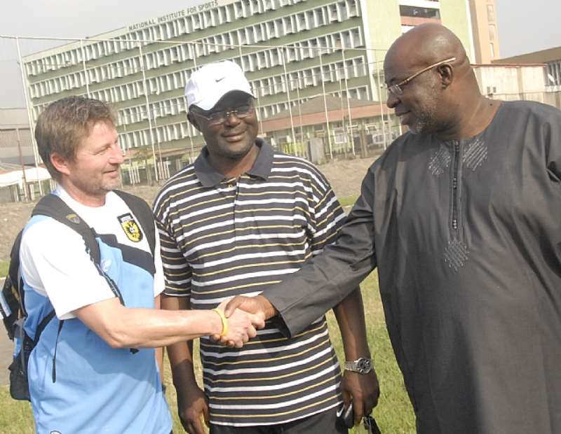 L-R: Mark Van Zon shaking hands with Barrister Seyi Akinwumi, Chairman Lagos Football Association while Godwin Dudu-Orumen,  Rector,Cowbell Football Academy looks on at the on-going training of 60 coaches and 400 youth footballers by Dutch youth football coaches at the National Stadium Surulere Lagos on Monday.