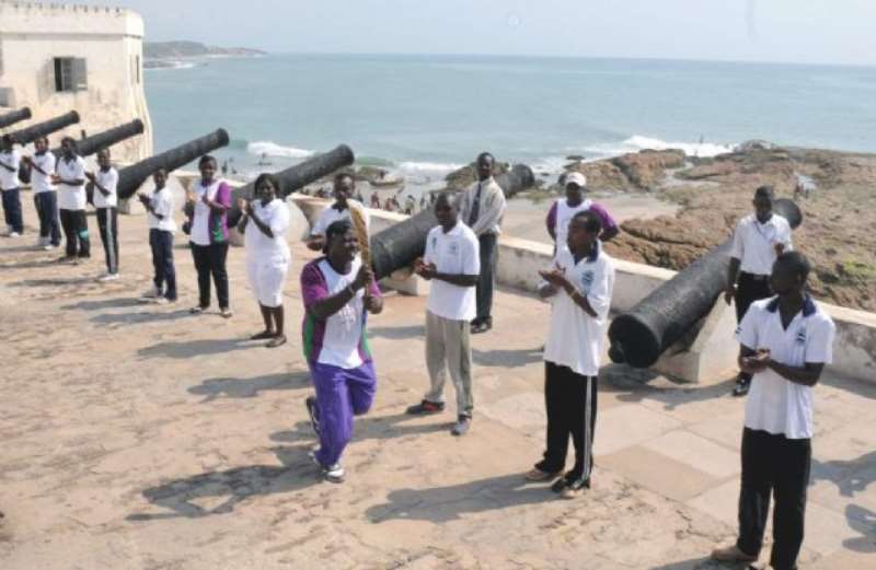 The historic Cape Coast Castle and the Atlantic Ocean provide a great backdrop for the Queens Baton Relay 2010 Delhi in Ghana on 17 December 2009.