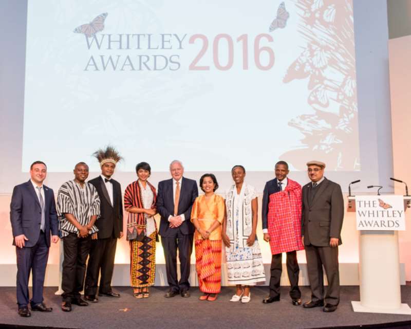 Gilbert In Smock With Other Winners In Group Picture With Sir David Attenborough