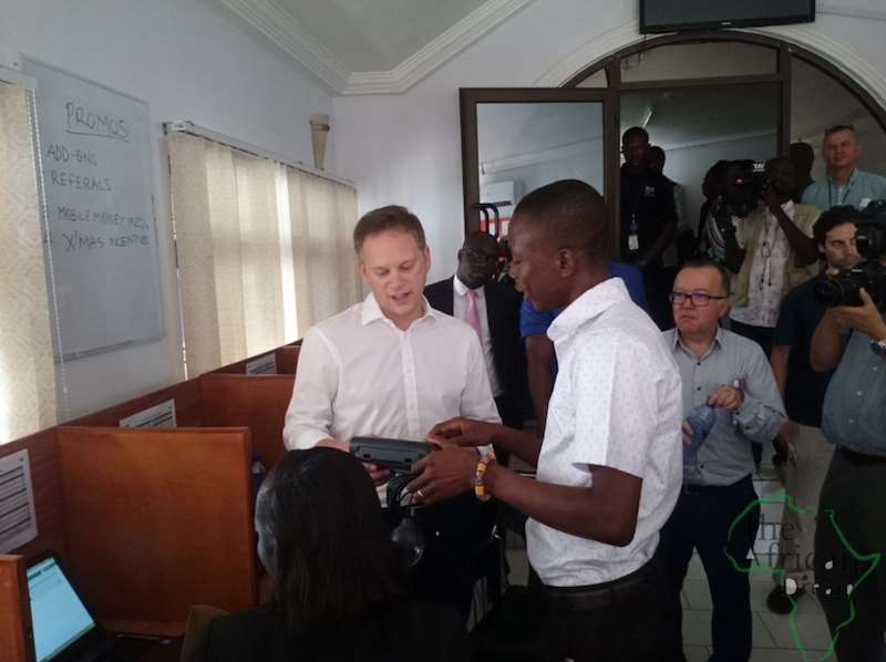 AN OFFICIAL OF PEG EXPLAINS HOW AN EQUIPMENT WORKS TO MINISTER SHAPPS ON LEFT