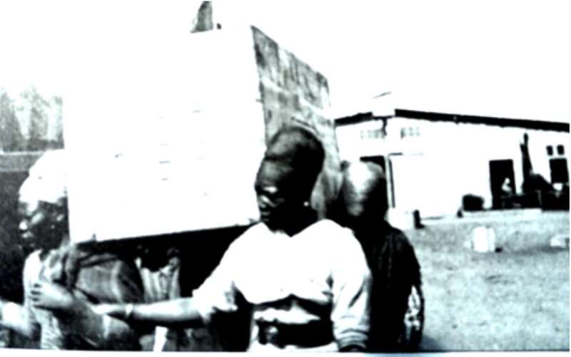 Herero women prisoners carrying heavy load.              http://en.wikipedia.org/wiki/Okahandja_Concentration_Camp