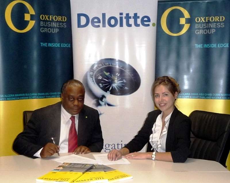 Mr. Felix Nana Sackey (Left), Senior Partner Of Deloitte & Touche Ghana Re-Signing The Partnership Agreement With Ms. Polina Virr, Country Director Of Oxford Business Group (Right), For The Report Ghana 2013