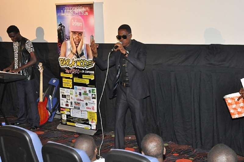 INDIGENOUS RAPPER DA EMPEROR PERFORMING ALONGSIDE A LIVEBAND