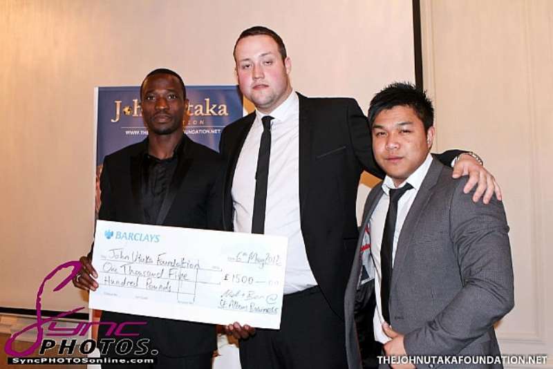 JOHN AND BARCLAYS BANK STAFF PRESNTING 1,500 CHEQUE