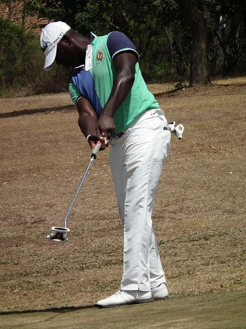 RICHARD CHIPS TO THE GREEN ON HOLE 18