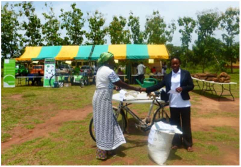 Nonia Kipo, First Prize Winner Being Presented With A Bicycle From Wenchi Rural Bank
