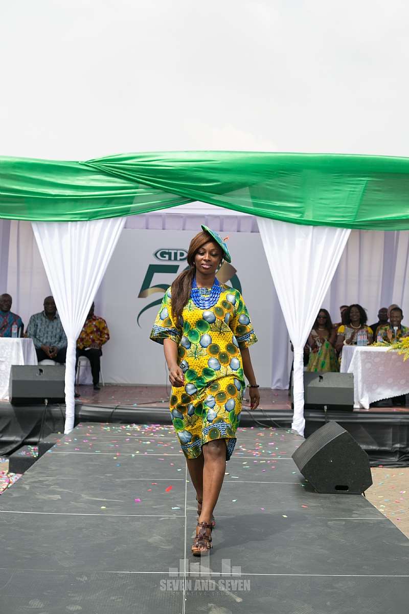 A FEMALE STAFF MODELLING ON THE RUNWAY AT THE CELEBRATION