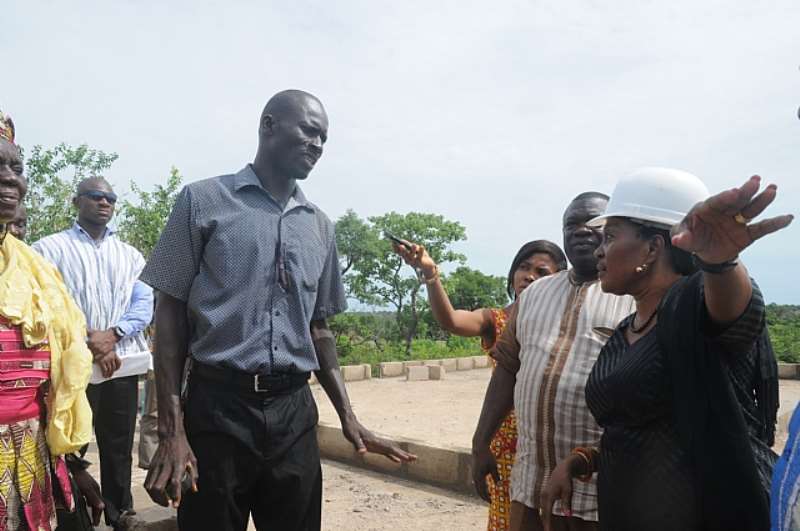 MRS LORDINA MAHAMA CHATTING WITH THE PROJECT ENGINEER AT THE PROJECT SITE