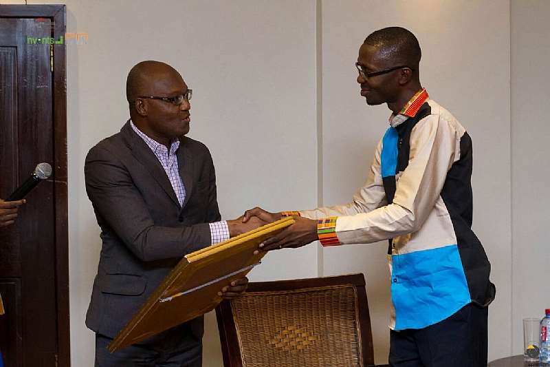 Role Model Africa Advisory Board Member Martin-luther C. King Presenting Bernard Avle With His Citation