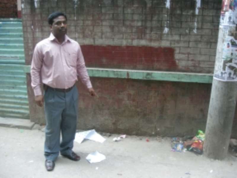 Ronjon Palma, a young Christian, showing the place where Costas body was found. (PhotoDipal Barua)