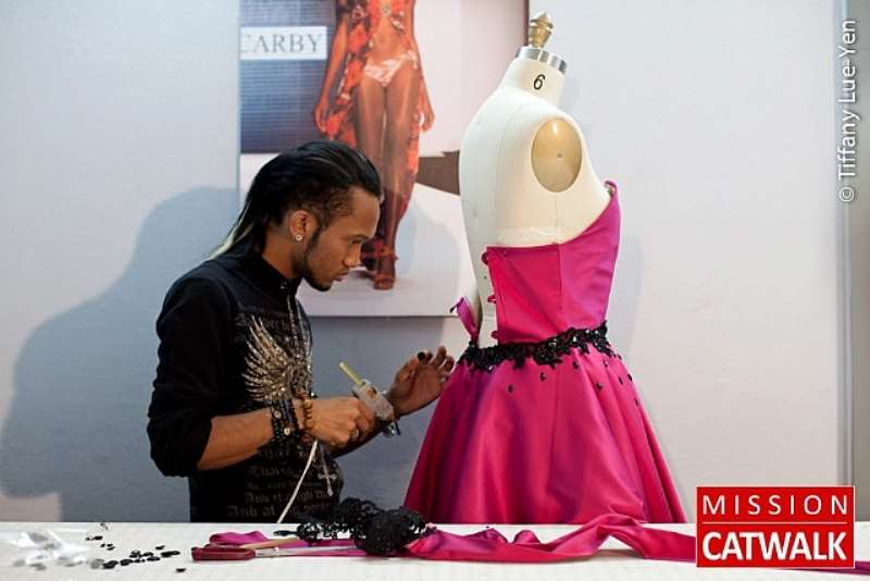 RYAN WORKS ON HIS DRESS IN THE SINGER SEWING ROOM- CREDIT TIFFANY LUE YEN