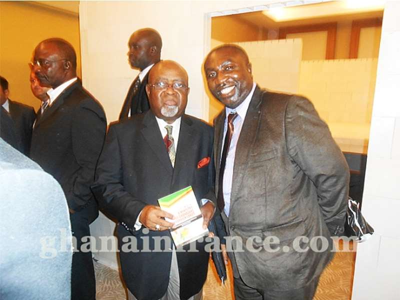 Mr. Osei Mensah and Gen Smith in a camera pose with the Book