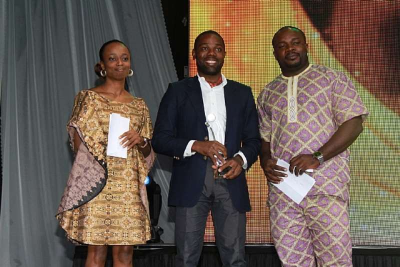 UGOCHUKWU OF MICROSOFT PRESENTS AWARD TO WINNER