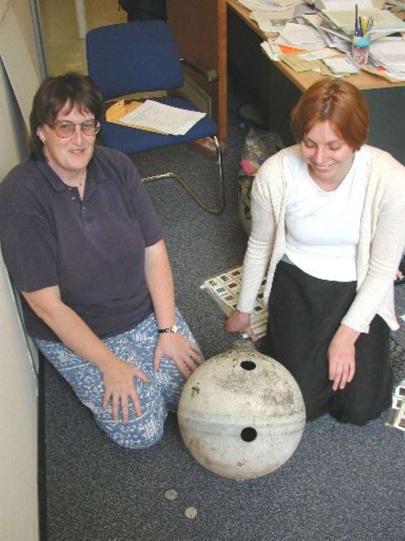 Dr.Monica Grady and Dr.Sara Russell in the Mineralogy Department of the NHM.The sample disks are in the foreground.