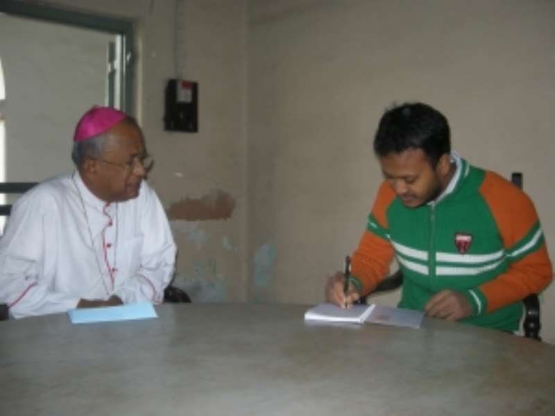 William Gomes (R) interviews the Archbishop of Dhaka Rev. Paulinus Costa at the St. Marys Cathedral in Dhaka on Dec. 25, 2009. (PhotoDipal Barua)